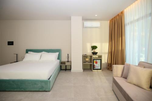 Ένα ή περισσότερα κρεβάτια σε δωμάτιο στο Toto Hotel & Apartments