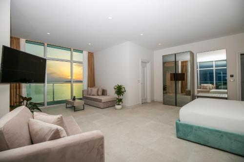 Ένα ή περισσότερα κρεβάτια σε δωμάτιο στο Toto Hotel & Apartments