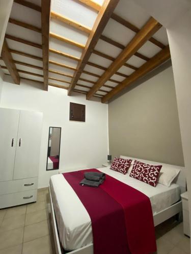 Una cama o camas en una habitación de Tyche Home
