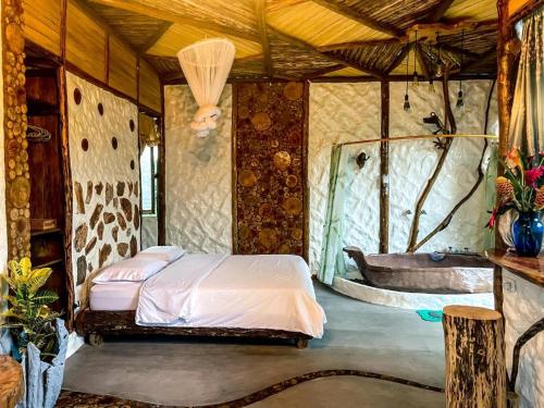 a bedroom with a bed in a tent at Alojamiento rural Bellavista Experiences in Mocoa