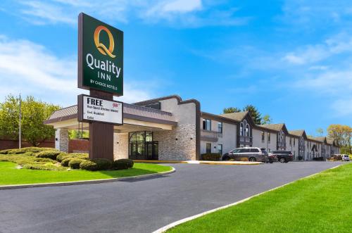 a quality inn sign in front of a building at Quality Inn South Bend near Notre Dame in South Bend