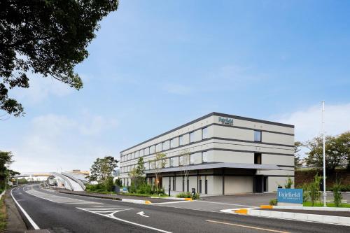 an office building on the side of a road at Fairfield by Marriott Mie Kumano Kodo Mihama in Mihama
