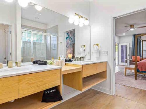 a large room with a desk with a mirror at Luxurious 4BR Beach House with Pool in Panama City Beach