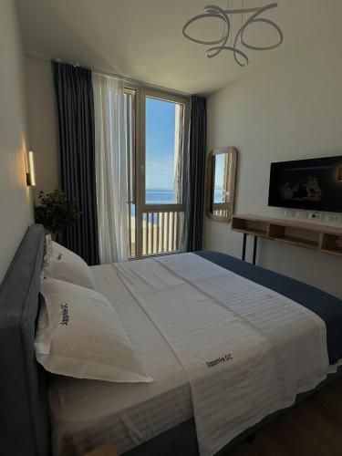 Ένα ή περισσότερα κρεβάτια σε δωμάτιο στο Sapphire Residence Green Coast