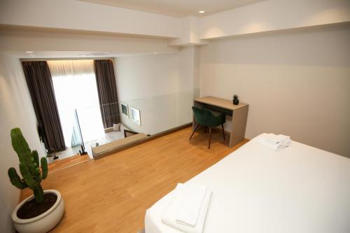 Ένα ή περισσότερα κρεβάτια σε δωμάτιο στο Toto Hotel & Apartments