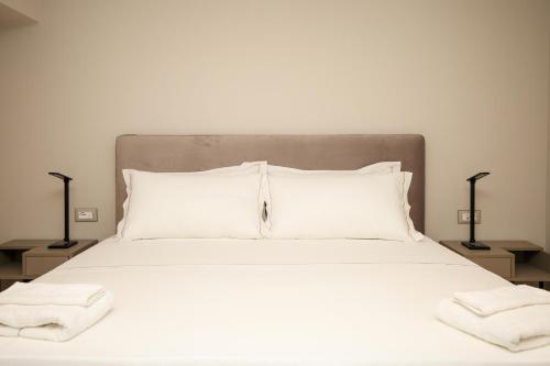 Ένα ή περισσότερα κρεβάτια σε δωμάτιο στο Toto Hotel & Apartments