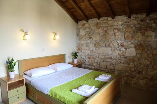 Postel nebo postele na pokoji v ubytování Fruit Garden Villas