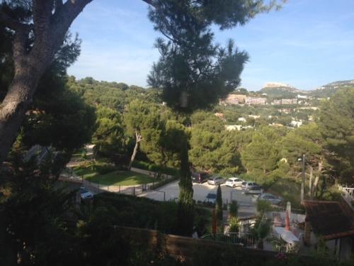 a view of a street in a town with trees at Villa W in Cassis