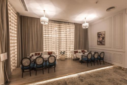 a dining room with a table and chairs at Gewan Resort New Alamein in El Alamein