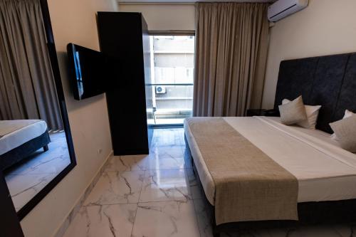 Katil atau katil-katil dalam bilik di Orient Queen Homes Hotel