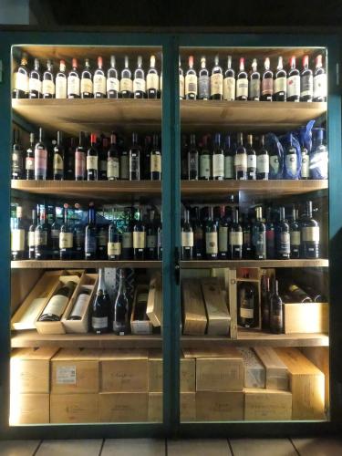 a refrigerator filled with lots of bottles of alcohol at Hotel La Torricella in Capalbio