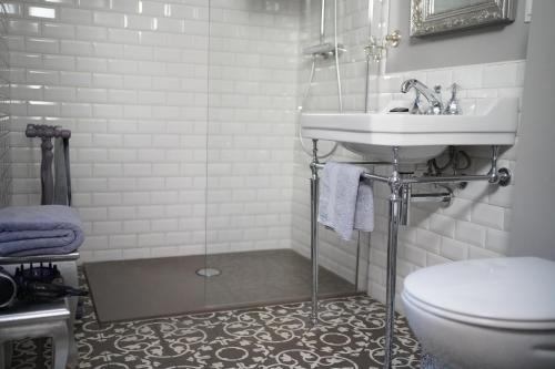 a bathroom with a sink and a toilet at B&B PETIT PRINCE, GENT in Ghent