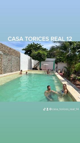a group of people swimming in a swimming pool at Casa Torices Real 12 in Cartagena de Indias