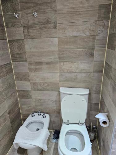 a bathroom with a toilet and a bidet at LaMari in Buenos Aires
