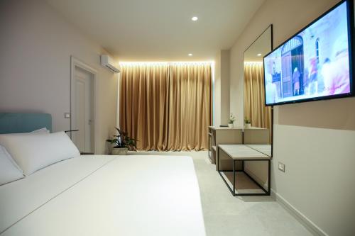 Μια τηλεόραση ή/και κέντρο ψυχαγωγίας στο Toto Hotel & Apartments