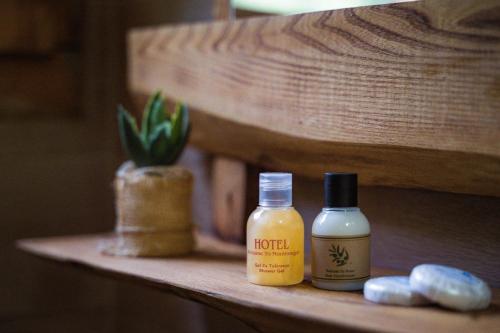 two bottles of moisturizers sitting on a shelf at Madre Natura Glamping in Ulcinj