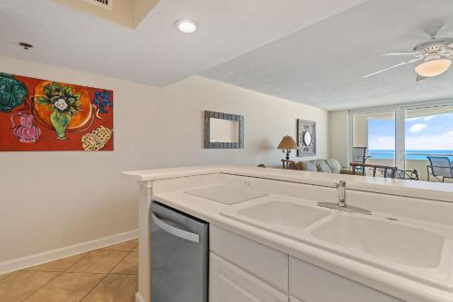 a white kitchen with a sink and a window at Perdido Sun 610 in Perdido Key