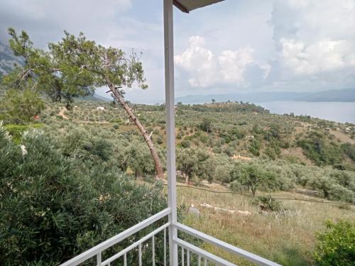 a view from the porch of a house overlooking the water at Kır evi in Mugla