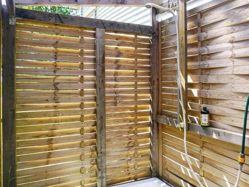 a wooden privacy fence in a shower stall at 6 person holiday home in SÖLVESBORG-By Traum in Sölvesborg