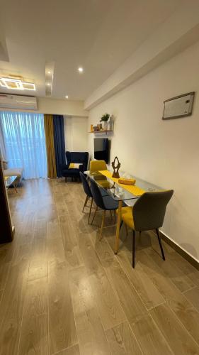 a living room with a dining table and chairs at Solaris Premium Luxury Living in Accra