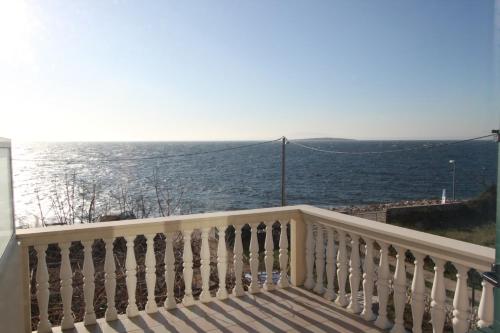 a balcony with a view of the ocean at Apartments Lunjski in Lun
