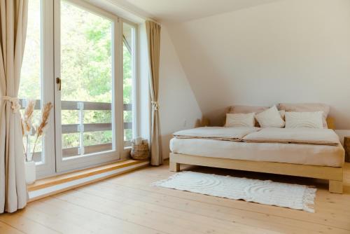 Una cama o camas en una habitación de Chata Šedivka