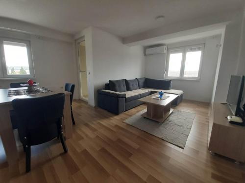 a living room with a couch and a table at Apartments Josif in Gevgelija