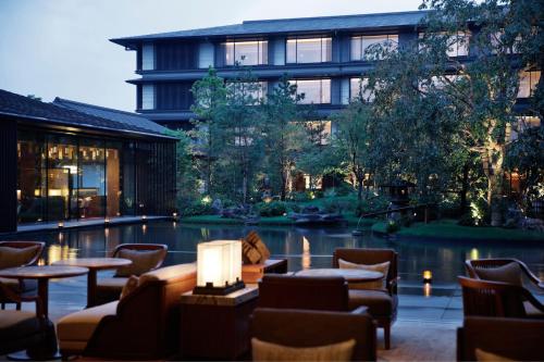 a hotel with a pool in front of a building at HOTEL THE MITSUI KYOTO, a Luxury Collection Hotel & Spa in Kyoto