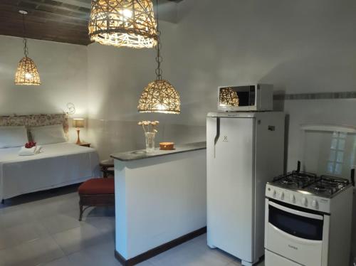 Dapur atau dapur kecil di Vila da Sol Itaipava casas e estúdios
