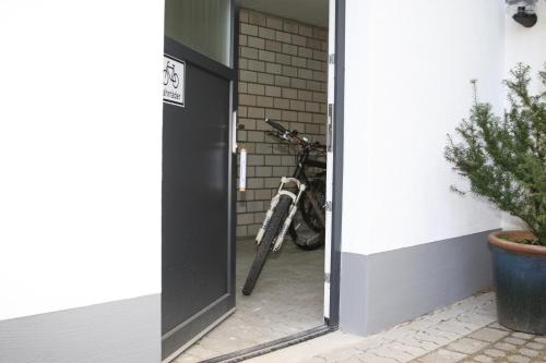a bike is parked next to a building at Hotel Bürger in Siegen
