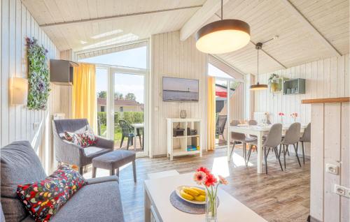 a living room with a table and a dining room at Freibeuterweg 20 - Dorf 5 in Travemünde
