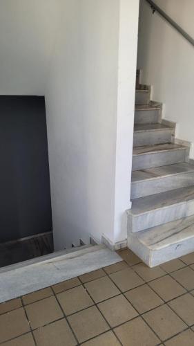 a set of stairs in a building with a door at Apartamento completo para São João in Campina Grande