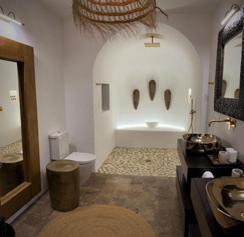 a bathroom with a tub and a toilet and a sink at VILLA SERENITY 3 Luxury boutique villa in Sant Jordi
