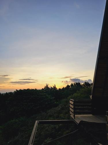 a view of a sunset from a building at Wind Houses, Casas de Viento in Monteverde Costa Rica