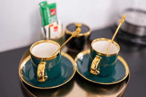 a pair of teacups on plates with chop sticks at Luxury Rooms "Kaleta" in Trogir