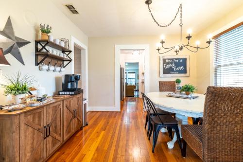 a kitchen and dining room with a table and chairs at Cypress Star in Bandera in Bandera