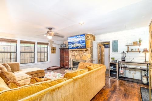 a living room with two couches and a fireplace at Cypress Star in Bandera in Bandera