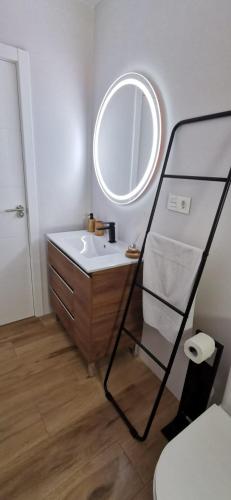 a bathroom with a sink and a mirror at Vistas mar y montaña LasNegras in Las Negras