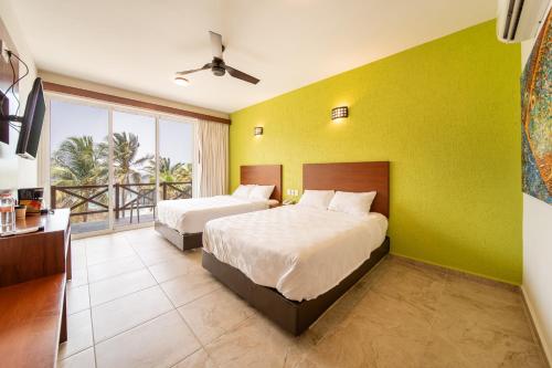 Postel nebo postele na pokoji v ubytování Villas Coral Huatulco