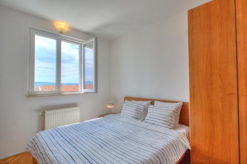 Ένα ή περισσότερα κρεβάτια σε δωμάτιο στο Anmarie Apartments Crikvenica