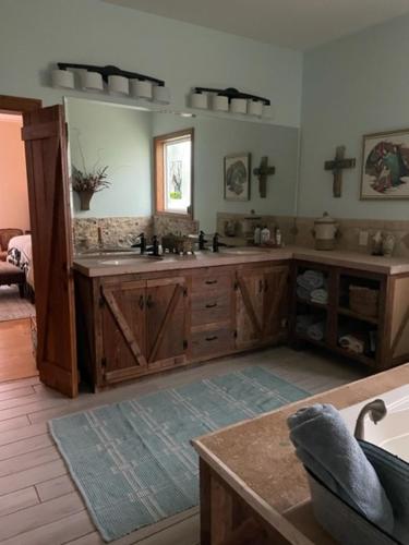 a large kitchen with a sink and a counter at Cajun-Get Away in Breaux Bridge