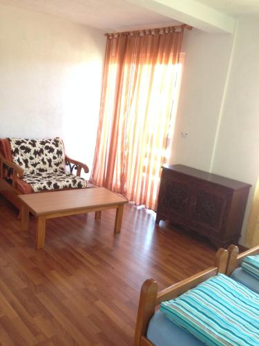 a living room with a couch and a chair at Apartment Ana Marija in Mavrovo