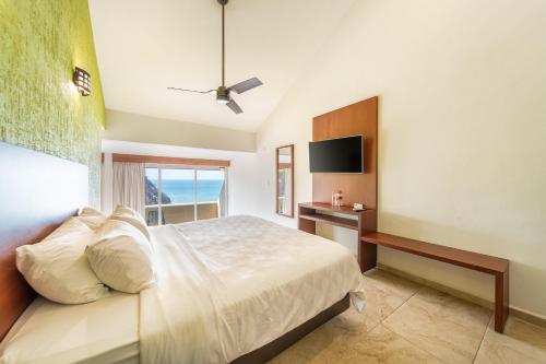 Postel nebo postele na pokoji v ubytování Villas Coral Huatulco
