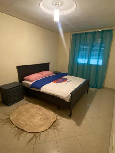 מיטה או מיטות בחדר ב-Appartement kenzi Beach