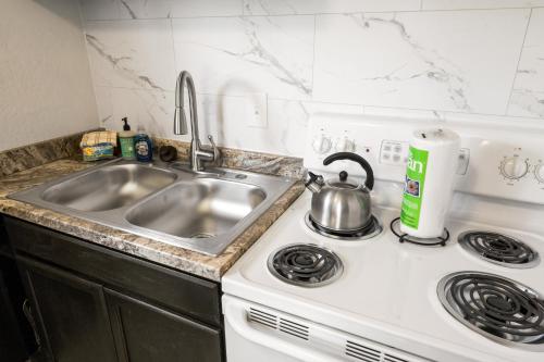 a kitchen with a sink and a stove at Alpine #2 in West Yellowstone