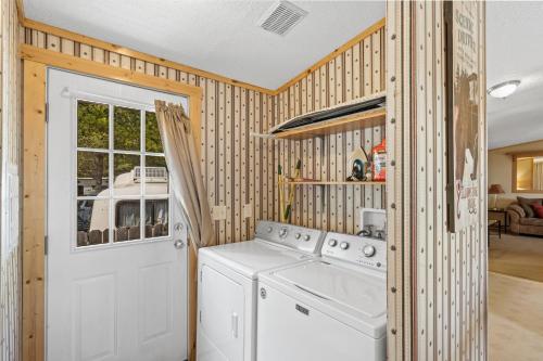 a kitchen with a washer and dryer in a house at Alpine #3 in West Yellowstone