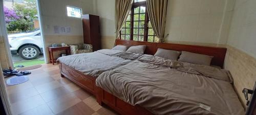 เตียงในห้องที่ Lucid Dream Villa Homestay