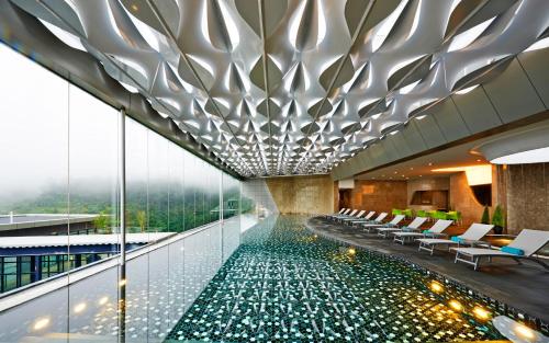 a swimming pool in the middle of a building at Sky Retreat Genting Highlands in Genting Highlands