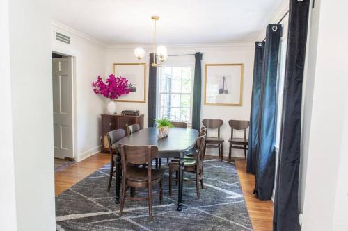 a dining room with a table and chairs at J Birds' Cottage Midtown Memphis in Memphis