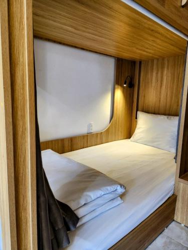 a large bed in a room with a window at Khách Sạn Thủ Đô Hanoi Capital Hotel in Hanoi
